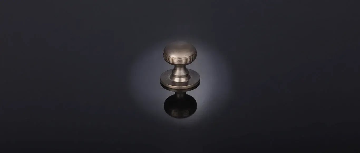 Contour bun cabinet knob with base by Samuel Heath