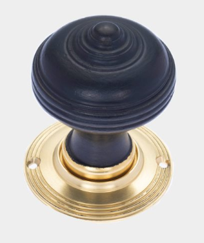 Dark wood and brass door knob combination, featuring elegant Georgian door ironmongery for heritage-inspired interiors.