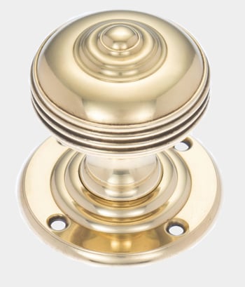 Polished brass door knob with classic detailing, showcasing Georgian door ironmongery for traditional period-style entrances.