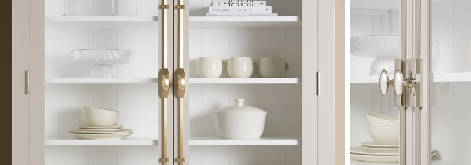 Elegant glass-front cabinet featuring brass hardware, showcasing cremone bolts for cabinet doors as a premium interior design feature.