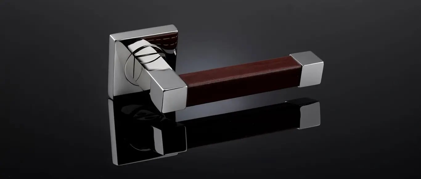 Square section leather lever handle by Turnstyle Designs
