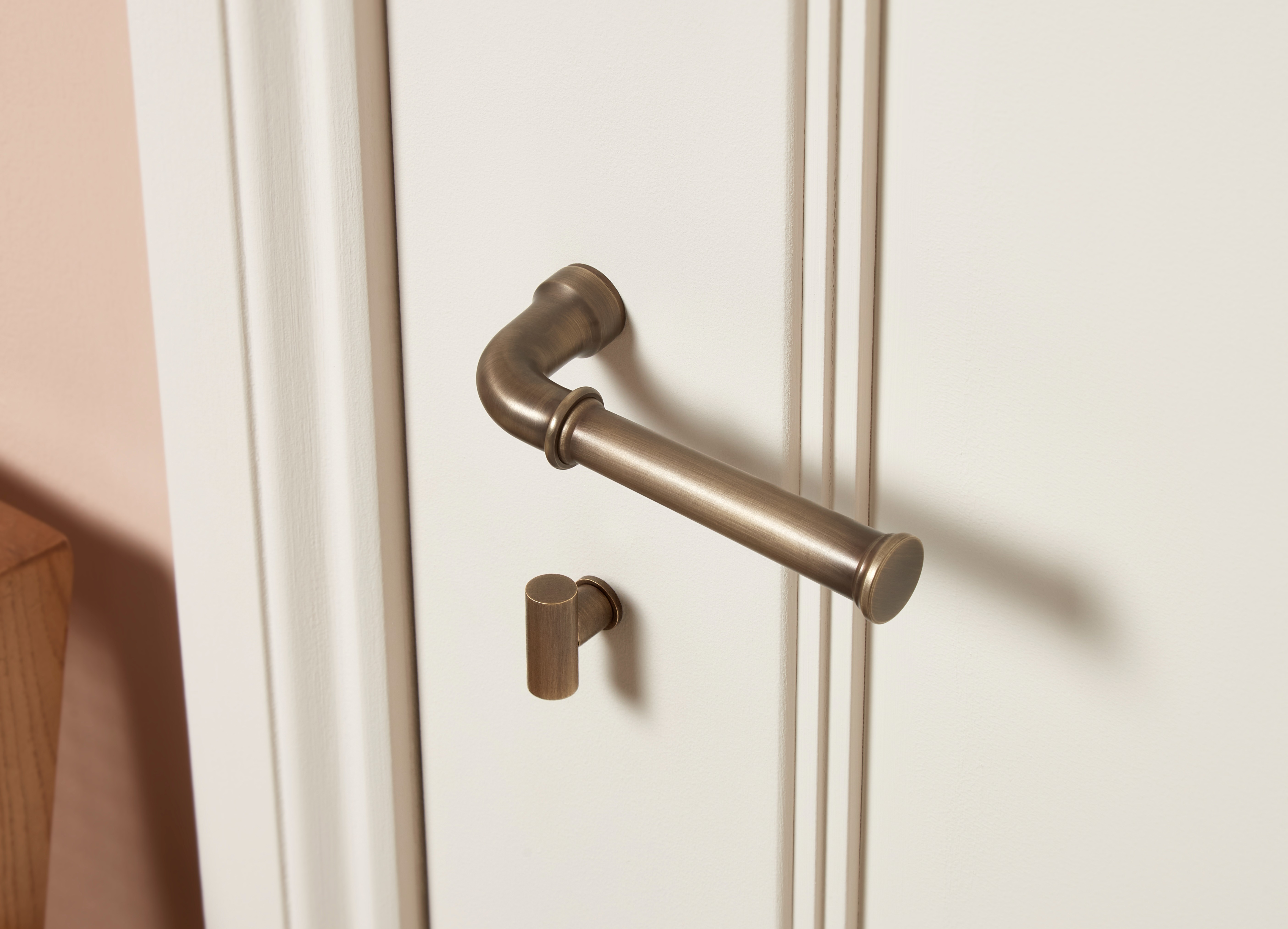 Minimal brushed brass rose door hardware with a clean, contemporary circular design.