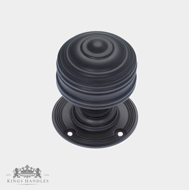 Traditional Door Hardware featuring a black textured door knob and circular backplate.