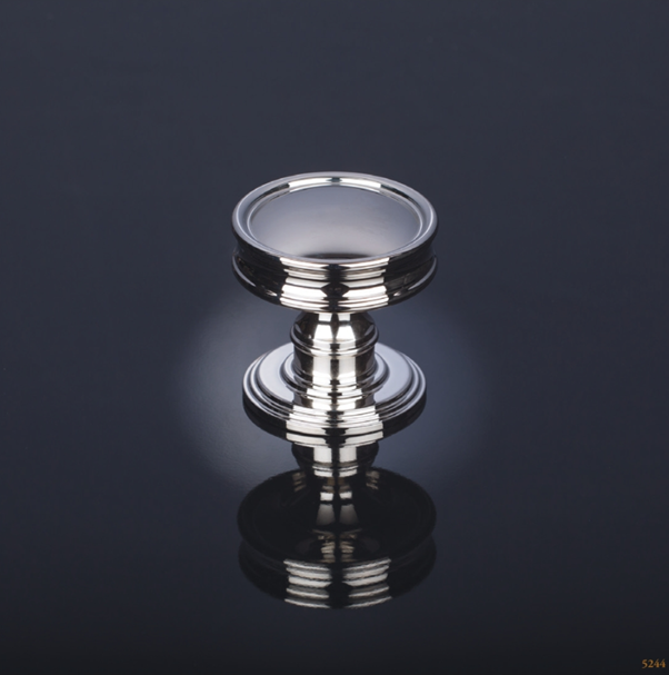 Polished metal door knob with classic detailing, showcasing architectural door ironmongery that balances compliance, functionality and premium design.